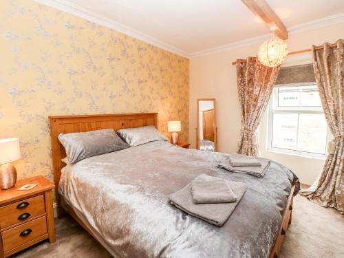 a bedroom with a bed and a window at Bellevue in Barnard Castle