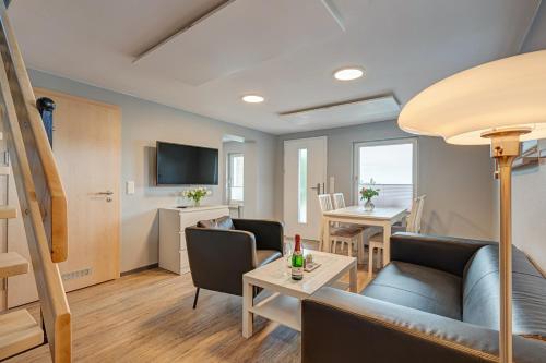 a living room with a couch and a table at Ferienhaus Hohe Klinge in Brotterode-Trusetal