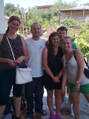a group of people posing for a picture at Giorgi's Homestay in Kutaisi