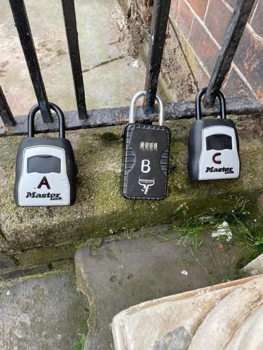 three electronic devices hanging on a swing set at Queen Street Apartments in Wolverhampton