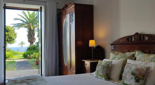 Un pat sau paturi într-o cameră la Vila Odette