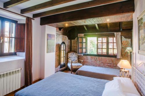 En eller flere senger på et rom på La Posada de Langre