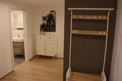 a bedroom with a bunk bed and a mirror at Apartment "Marie" in ehemaliger Schuhfabrik in Herxheim