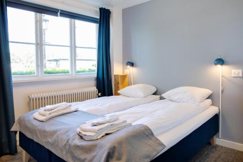 Ein Bett oder Betten in einem Zimmer der Unterkunft Kridthuset Stevns Klint