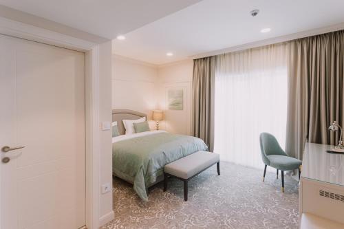 Кровать или кровати в номере Hotel Divine Park