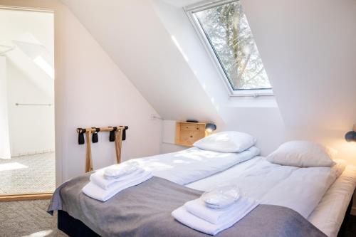 Кровать или кровати в номере Kridthuset