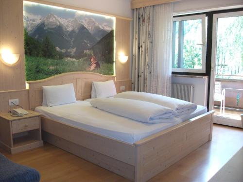 Posteľ alebo postele v izbe v ubytovaní Hotel Schwarzbachhof