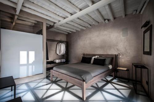a bedroom with a bed and a projection screen at Case D'a Mare Mondello in Mondello