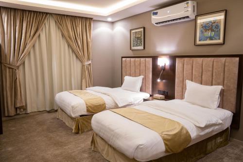 Cama o camas de una habitación en مستقر للشقق المخدومة النقرة