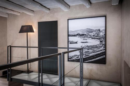 a picture of a river on the wall of a building at Case D'a Mare Mondello in Mondello
