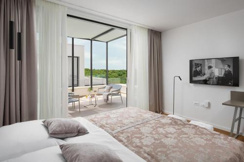 Posteľ alebo postele v izbe v ubytovaní Design Villa Noble with Spa