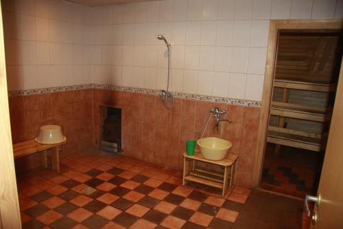 a bathroom with a tub and a sink and a shower at Hostel Laguun in Kallaste