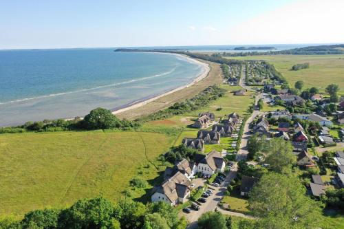 an aerial view of a subdivision of houses next to the beach at F-1010 Strandhaus Mönchgut Bed&Breakfast DZ 33 Balkon, strandnah, inkl Frühstück in Lobbe