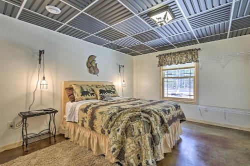 a bedroom with a bed and a coffered ceiling at Spacious Hurley Home with Game Room Near Lakes in Hurley