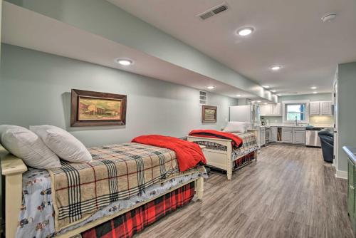 a room with two beds and a kitchen at Renovated Lakeside Home with Private Boat Dock! in Pine Crest