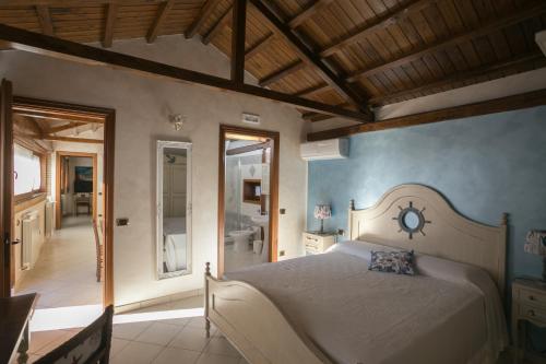 Posteľ alebo postele v izbe v ubytovaní B&B oasi di mamma clara