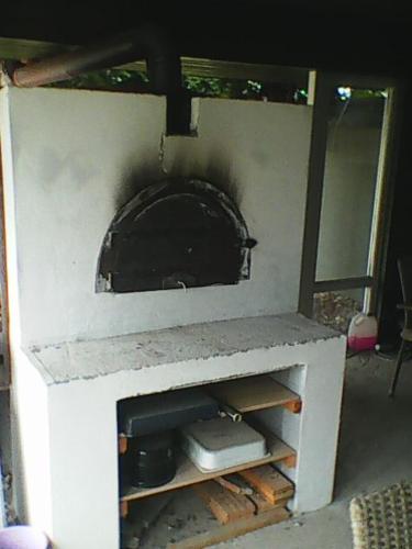 a fireplace in a living room with at CIMA-pre nenáročných in Podhájska