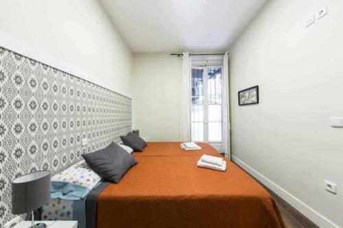 Postel nebo postele na pokoji v ubytování Céntrico apartamento entre Sol, Ópera y Pza Mayor