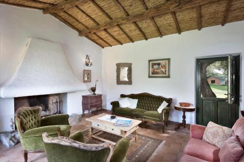 a living room with a couch and a table at Stazzo Lu Ciaccaru in Arzachena