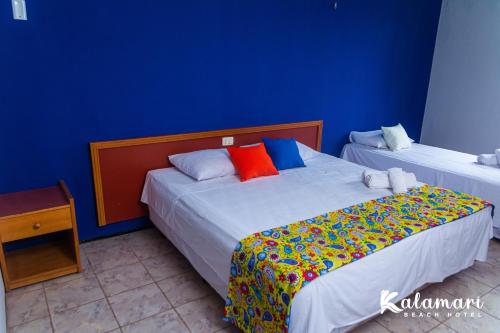 Ένα ή περισσότερα κρεβάτια σε δωμάτιο στο Kalamari Beach Hotel