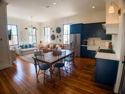 a kitchen and living room with a table and chairs at Guesthouse Charleston EAST 46 G and H in Charleston