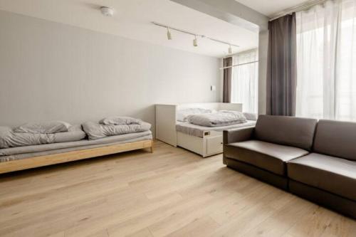 a living room with two beds and a couch at Marvelous Ryogoku - Vacation STAY 74216v in Tokyo