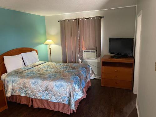 Cama o camas de una habitación en Countryside Motel