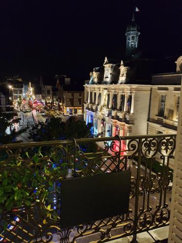 a view of a city at night with a building at Le cœur de Troyes - Appartement & Studio in Troyes