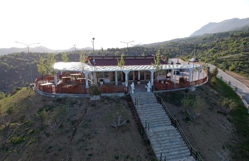 an overhead view of a house on a hill at Bujtina e Muriqit in Shkodër