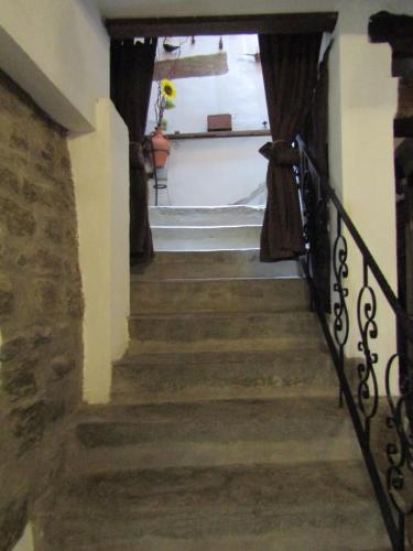 a stairway leading up to a room with a window at Cal Belló Casa rural in Lleida