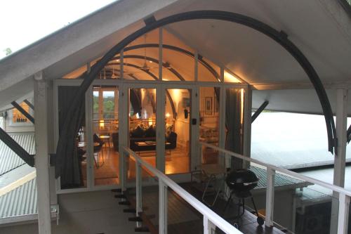 an arched entryway to a house with a living room at SEAVIEWS Oak Beach in Oak Beach