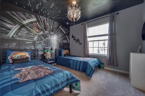 a bedroom with two beds in a room with a spiderweb ceiling at Windsor Island Resort 5 Bedroom Townhome Private Pool Disney in Davenport