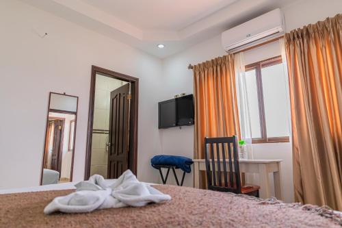 Ein Bett oder Betten in einem Zimmer der Unterkunft Hotel Santa Fe