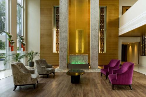 a living room filled with furniture and a couch at Radisson Blu Anchorage Hotel in Lagos