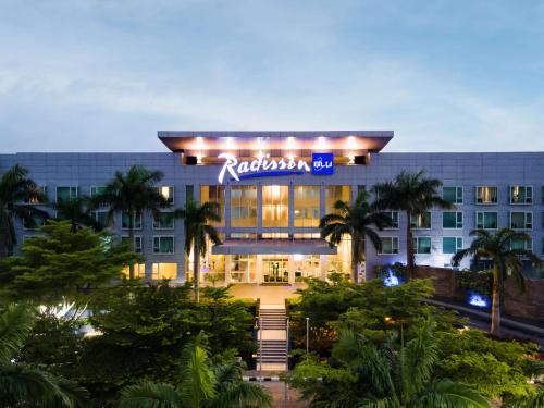 a hotel with a sign on the front of it at Radisson Blu Anchorage Hotel in Lagos