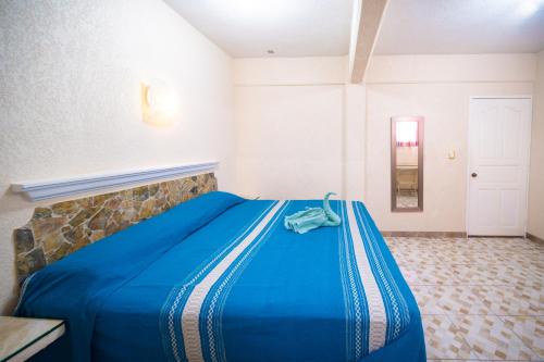PENINSULA STAYS Executive Hotel tesisinde bir odada yatak veya yataklar