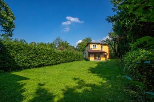 a large yard with a house in the background at The Doctor's House in Sapanca