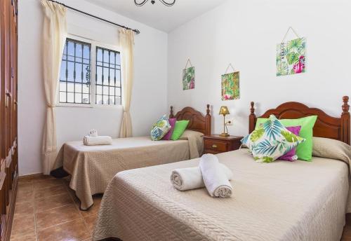 Ένα ή περισσότερα κρεβάτια σε δωμάτιο στο Villa Manuel in Nerja