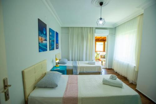 a bedroom with two beds and a window at The Doctor's House in Sapanca