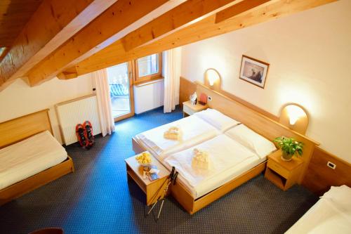 Postel nebo postele na pokoji v ubytování Hotel Waldheim