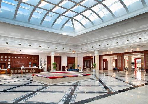 a large lobby with a large glass ceiling at Premier Le Reve Hotel & Spa Sahl Hasheesh - Adults Only 16 Years Plus in Hurghada