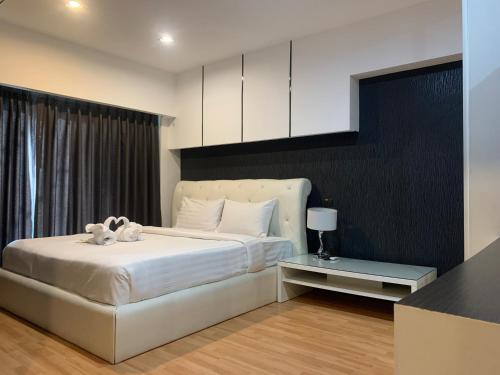 Ένα ή περισσότερα κρεβάτια σε δωμάτιο στο Khonkaen Residence