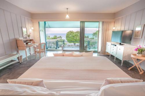 Postel nebo postele na pokoji v ubytování Devasom Hua Hin Resort