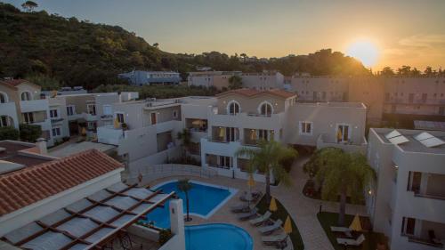 an aerial view of a building with a swimming pool at Toxo Hotel in Plataniás