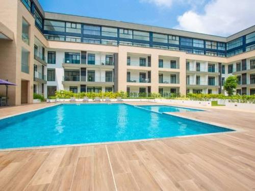 The swimming pool at or close to The Avery Loft at Embassy Gardens, Cantonments