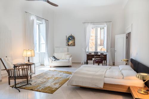 Postel nebo postele na pokoji v ubytování Palazzo Charlie