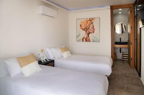 Ένα ή περισσότερα κρεβάτια σε δωμάτιο στο COCO by AGM Resorts