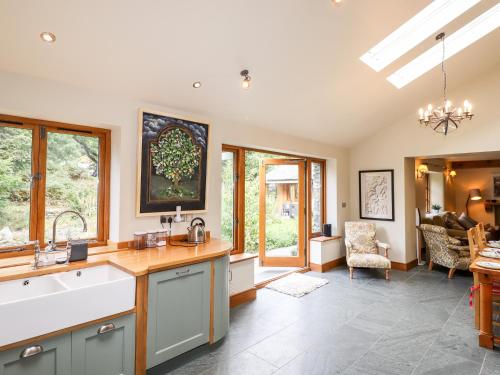 a kitchen with a sink and a counter at Eagle Farmhouse in Glenridding