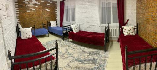 מיטה או מיטות בחדר ב-Kolsay Aisha
