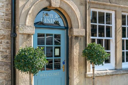 a door to a pub and dining establishment at The Kings Arms Hotel in Melksham